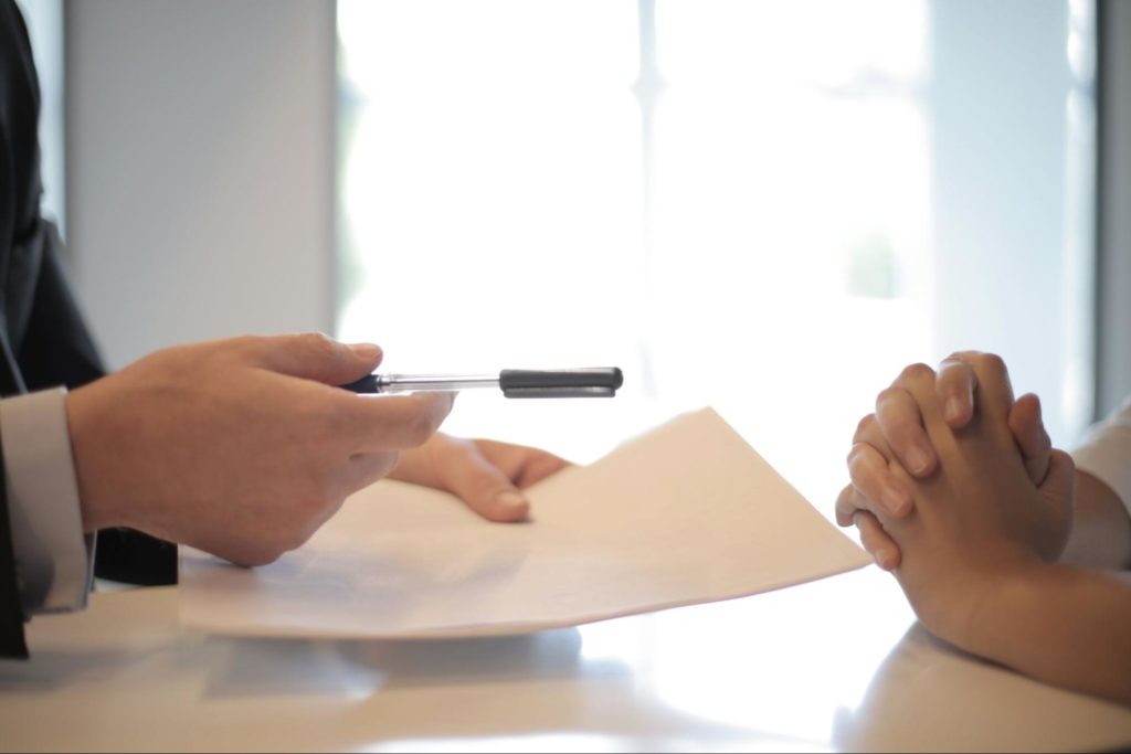 Two people examining an insurance document